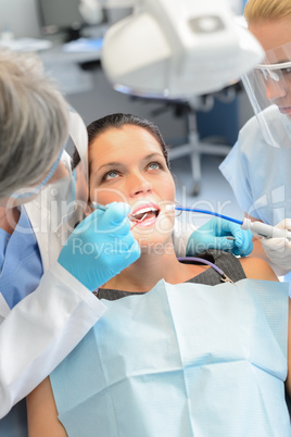 Dental team checkup woman patient teeth