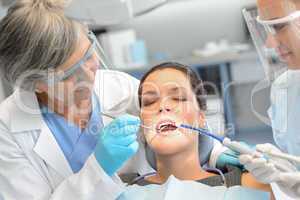 Dental check woman patient dentist team