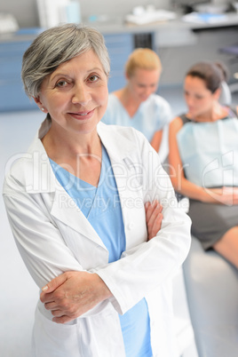 Professional dentist woman patient at dental surgery