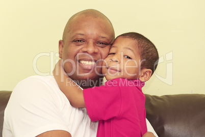Portrait of african father and his son.  Focus in the kid.