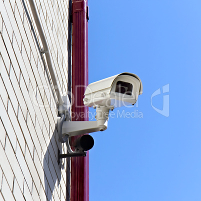 video surveillance camera on a wall of the building
