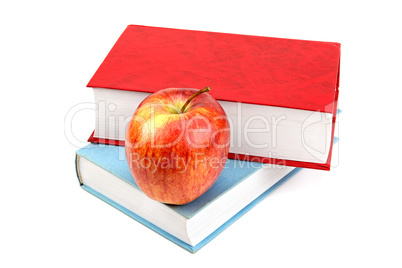 books and red apple isolated on white background