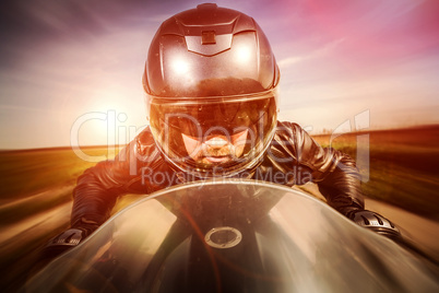 Biker racing on the road