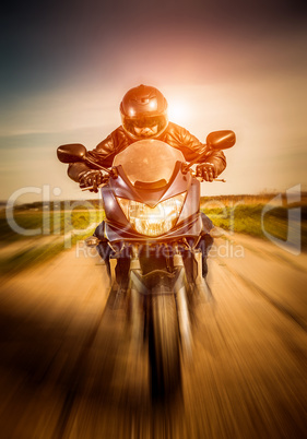 Biker racing on the road