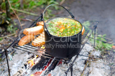 The cooking of soup on the fire