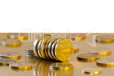 Coins are reflecting in the Golden surface
