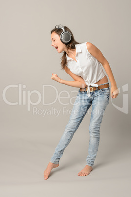Singing girl with headphones enjoy dance