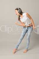 Singing girl with headphones enjoy dance