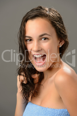 Cheerful teenage girl  wet hair care