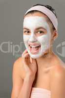 Teenage beauty smiling girl white facial mask
