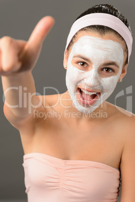 Teenage girl facial mask beauty shouting thumb-up