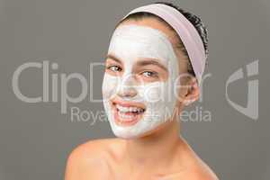 Smiling teenage girl face mask bare shoulders