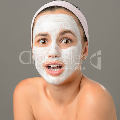 Surprised teenage girl looking camera face mask