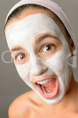 Crazy teenage girl face mask open mouth