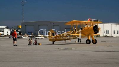 "Single engine Boeing Stearman Kaydet Trainer  Rolling to tarmac for demo flight"