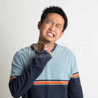 Asian man sore throat