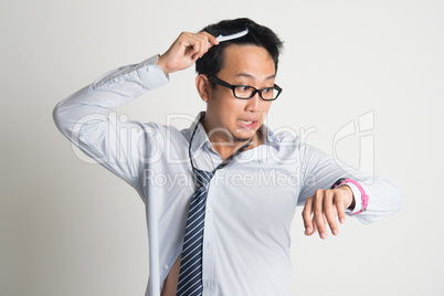 Businessman combing hair in morning in hurry
