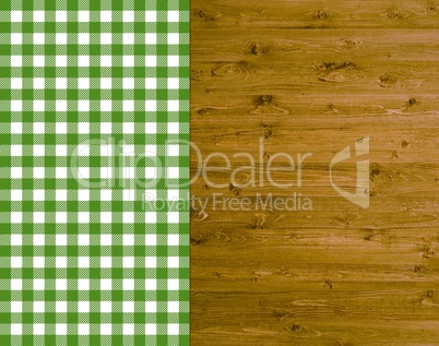 Traditioneller Hintergrund - Holz mit grün-weißer Tischdecke