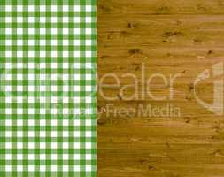 Traditioneller Hintergrund - Holz mit grün-weißer Tischdecke
