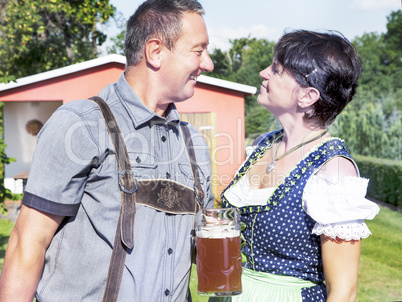 Man and woman with beer mug in Bavaria