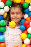 girl in toy balls