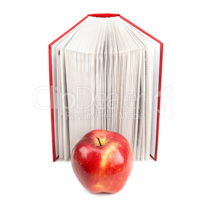 books and red apple isolated on white background