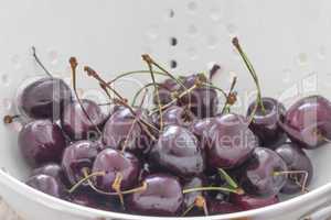 Fresh Cherries in a Sieve