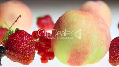 Fresh sweet fruit and berries with water drops dolly shot