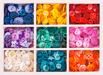 multicolor buttons  for handicrafts in box isolated on white