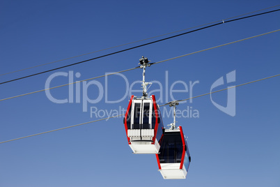 Two gondola lifts close-up view