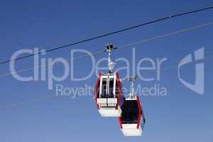 Two gondola lifts close-up view