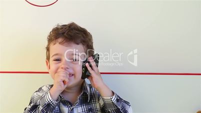 Little boy talking on the smartphone 1