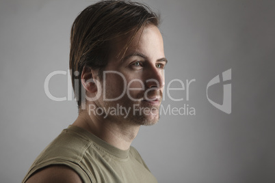 Portrait of an attractive man with green shirt