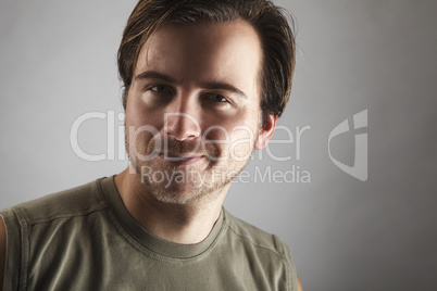 Portrait of an attractive man with green shirt