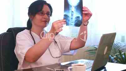 Doctor Examining X-Ray Films
