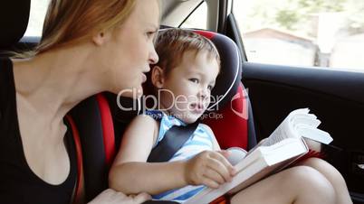 Mother talking to son while they in the car