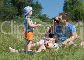 Family outdoor on a bright summer day