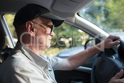 Senior man at the wheel