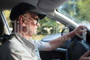 Senior man at the wheel