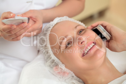 Woman having a phone talk at beauty spa