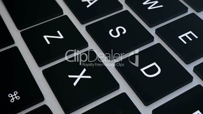 Closeup of laptop's keyboard pan.