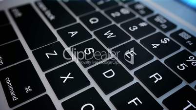 Closeup of laptop's keyboard pan.