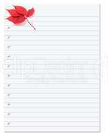 Notebook paper with red autumn virginia creeper leaf in corner