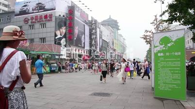 Street view in Wangfujing street at daytime. HD.