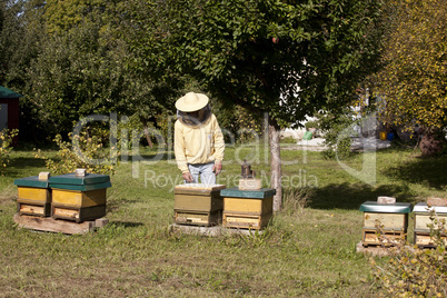 beekeeper with hive