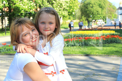 mother and daughter are embracing