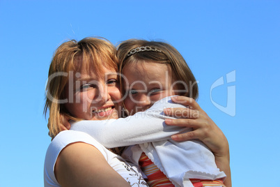 mother and daughter embrace