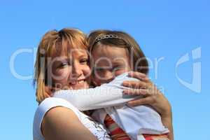 mother and daughter embrace