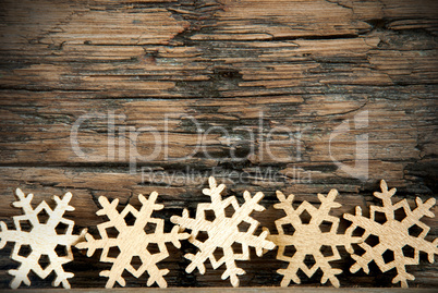 Golden Snowflakes on Wood