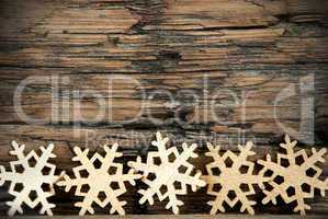 Golden Snowflakes on Wood